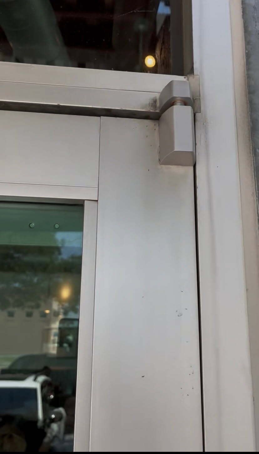 A close up of a white door with a window