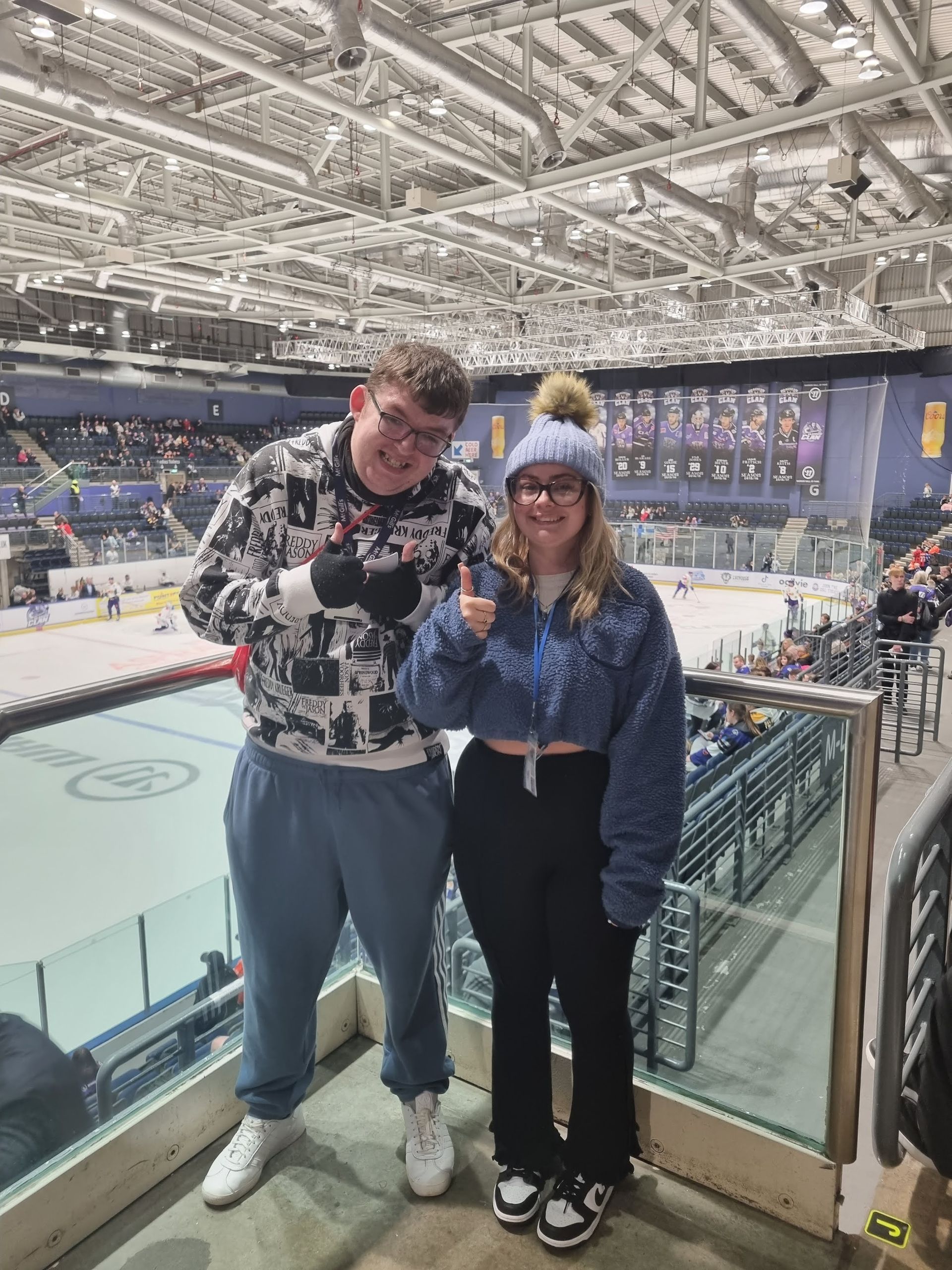 Service user being supported to enjoy his favourite Hockey team.