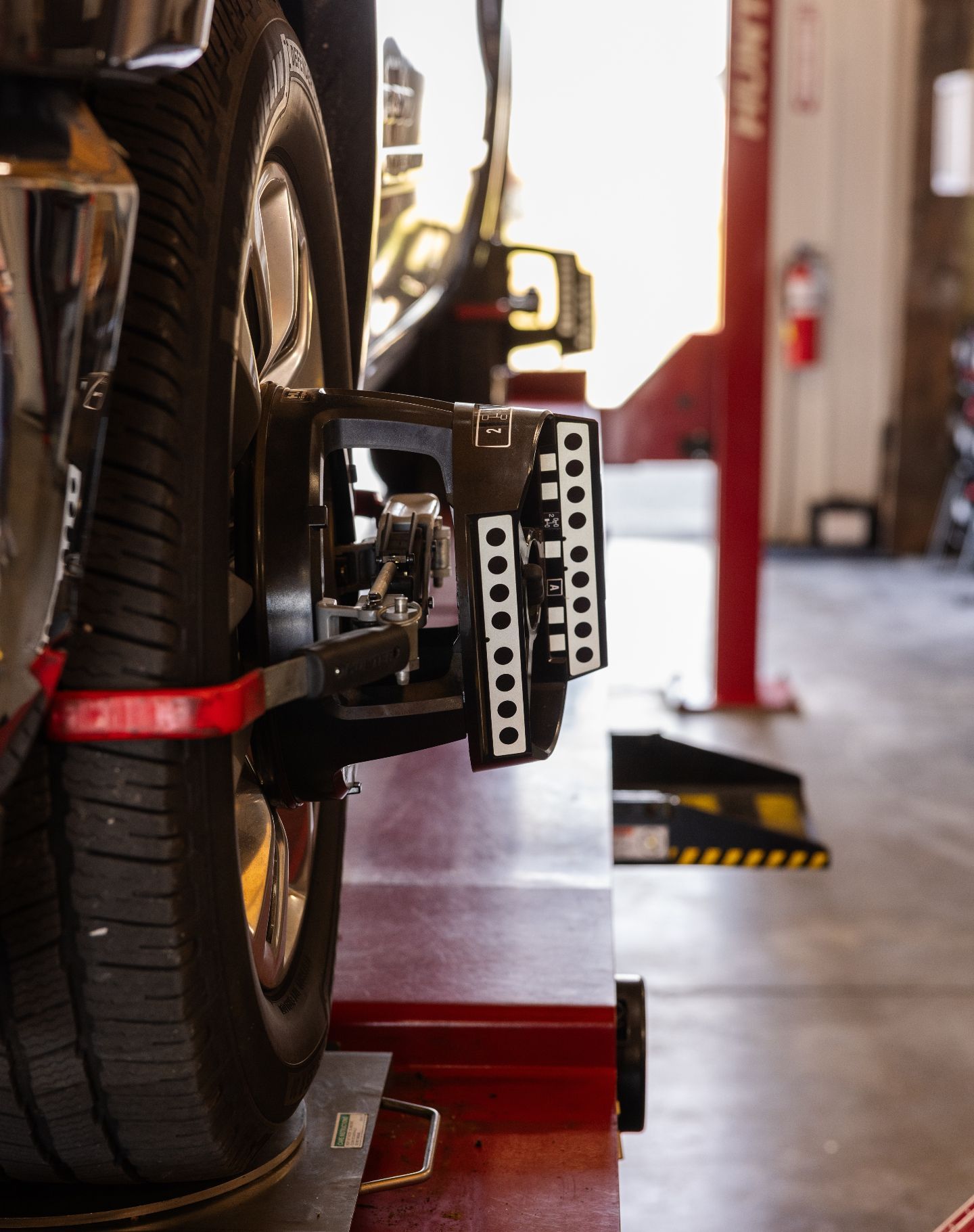 Close-Up Of Wheel Alignment Setup In Auto Shop | Craig Automotive Services