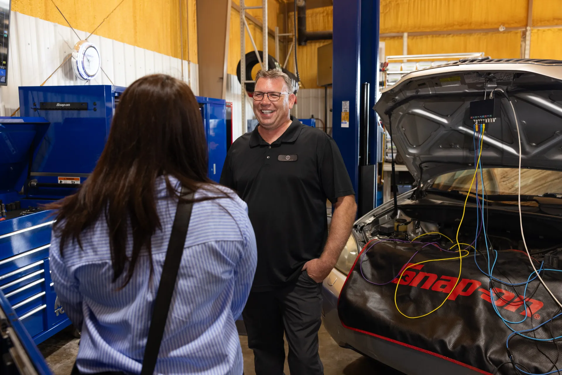 Person Speaking in an Auto Repair Shop | Craig Automotive Services