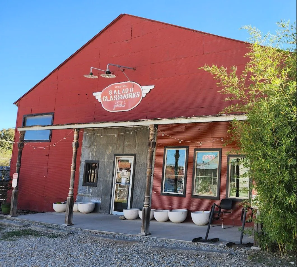 A red building with a sign that says ranch glasswares