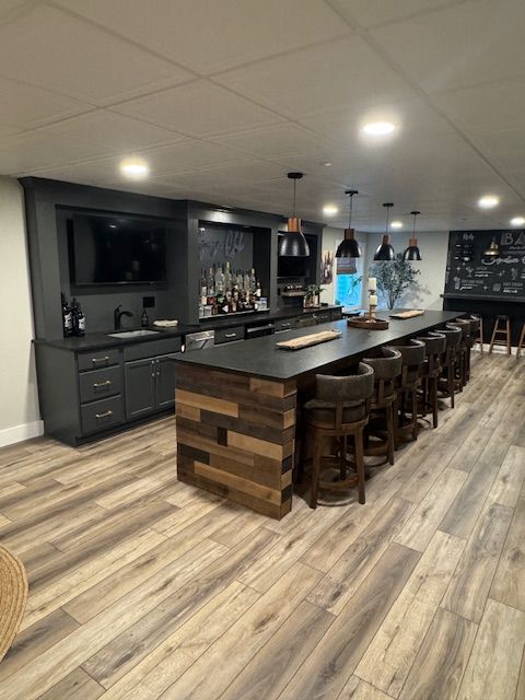 A kitchen with a large island and stools