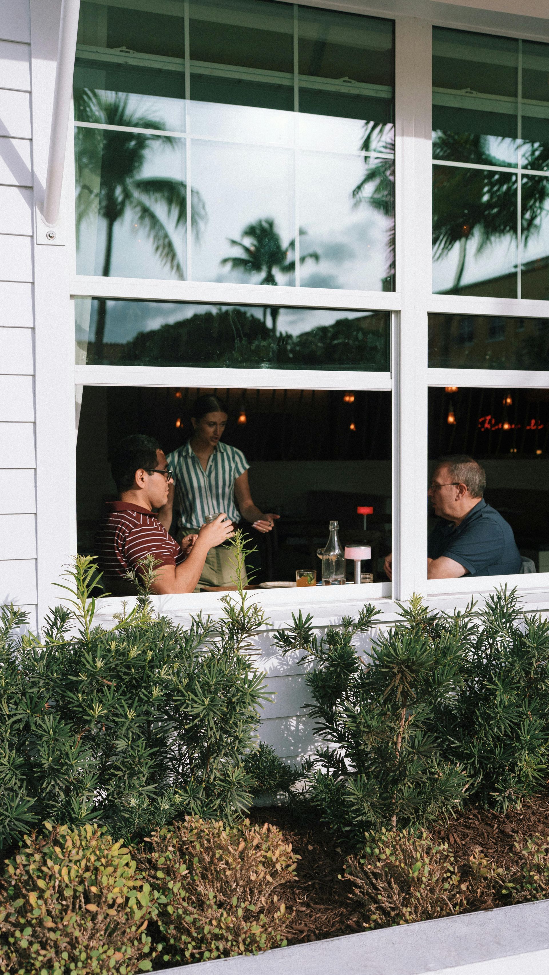 How to Stay Vegan while Dining Out - people eating at a restaurant