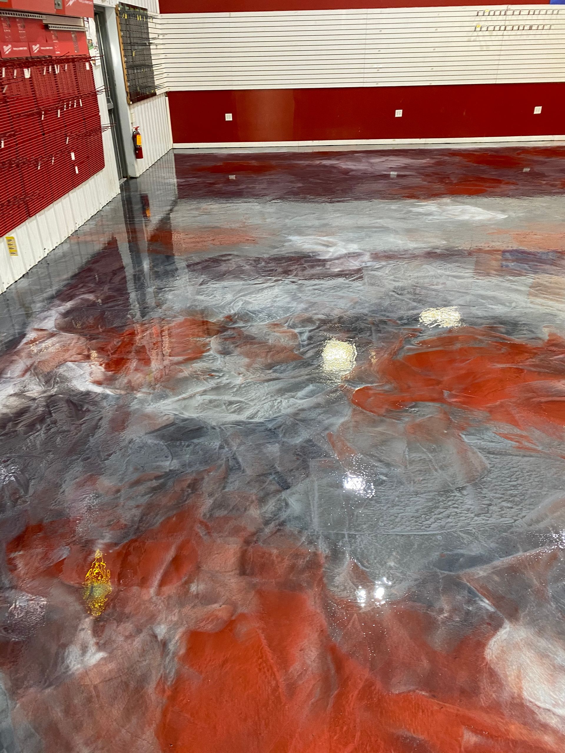 A close up of a shiny metallic floor in a room.