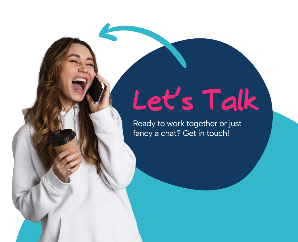 A woman is holding a cup of coffee and talking on a cell phone.