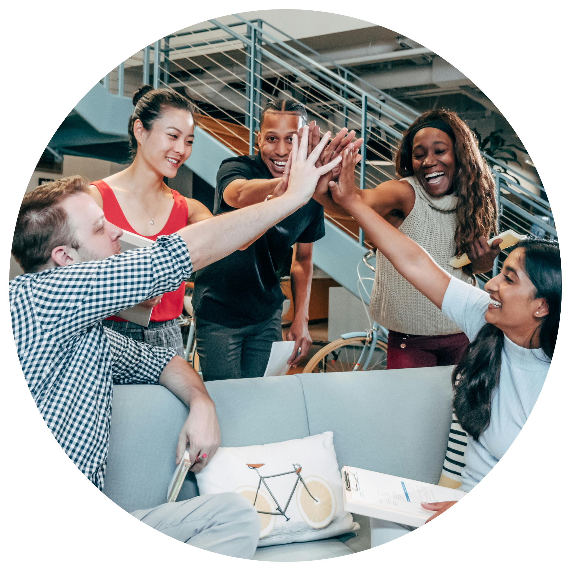 A group of people are giving each other a high five.