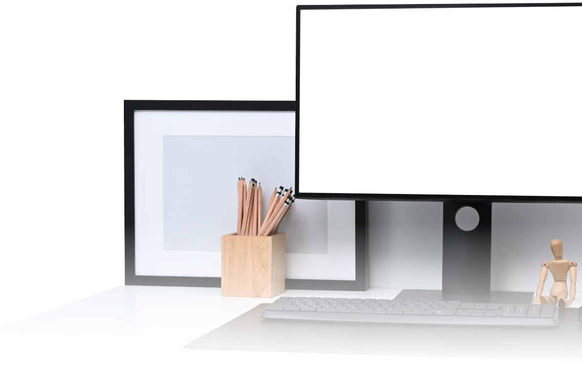 A computer monitor with a white screen is sitting on a desk.