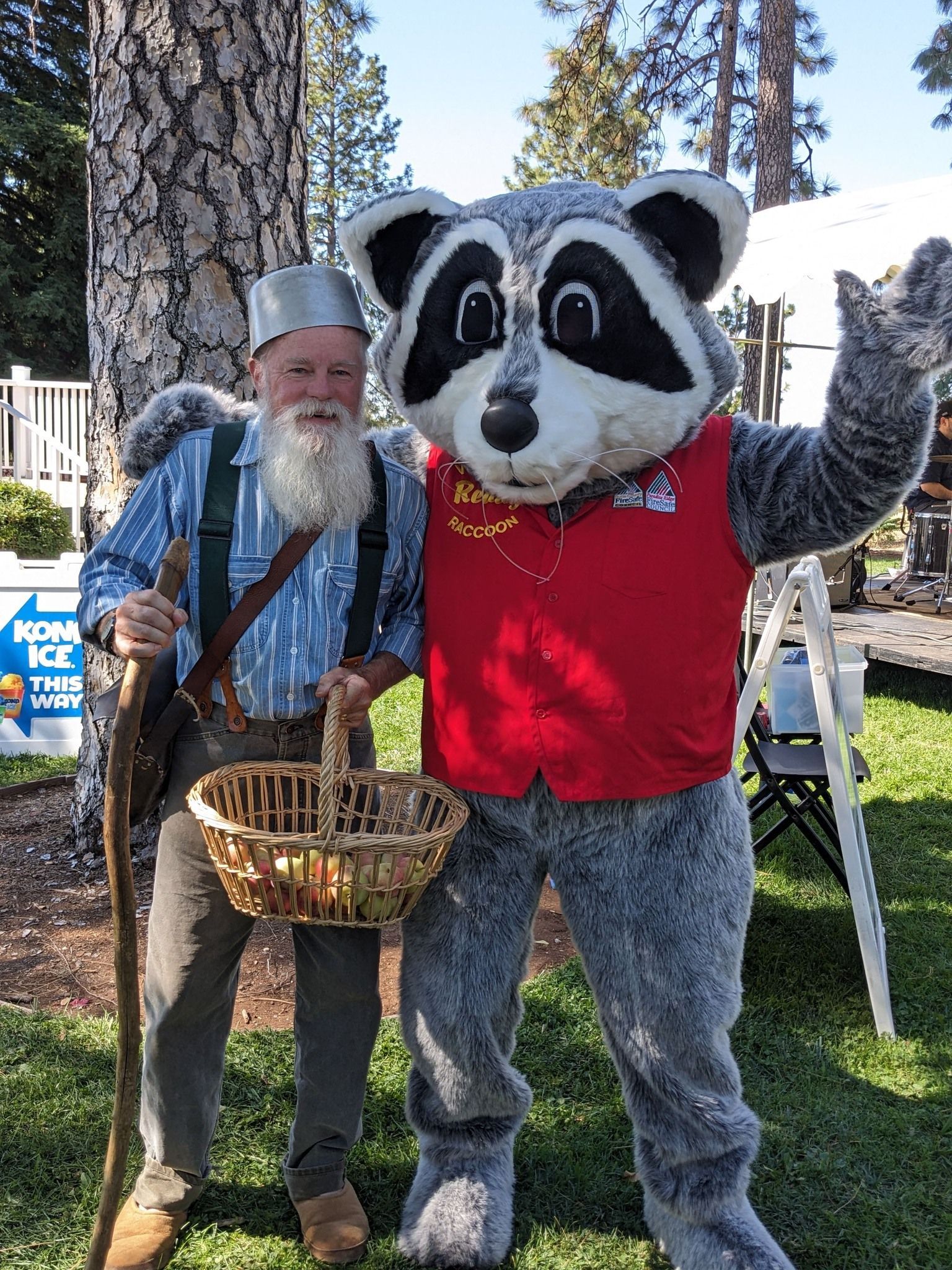 Johnny Appleseed posing for a photos with Butte County Firesafe Councils Ready Raccoon