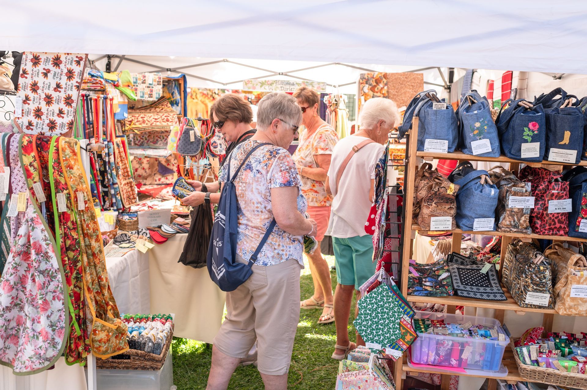 A group of people are shopping at a market.