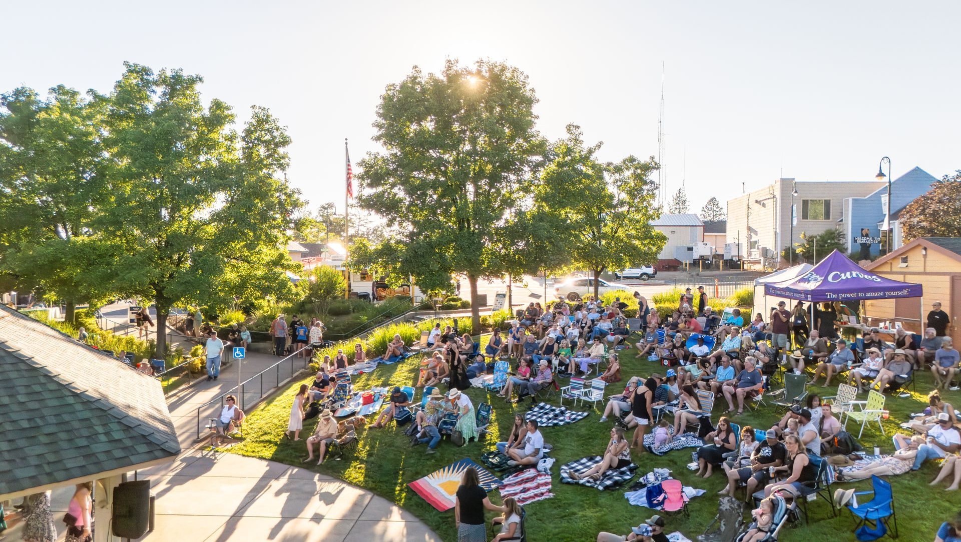 Paradise California Party in the Park Event. Paradise residents watching a concert together in the park.