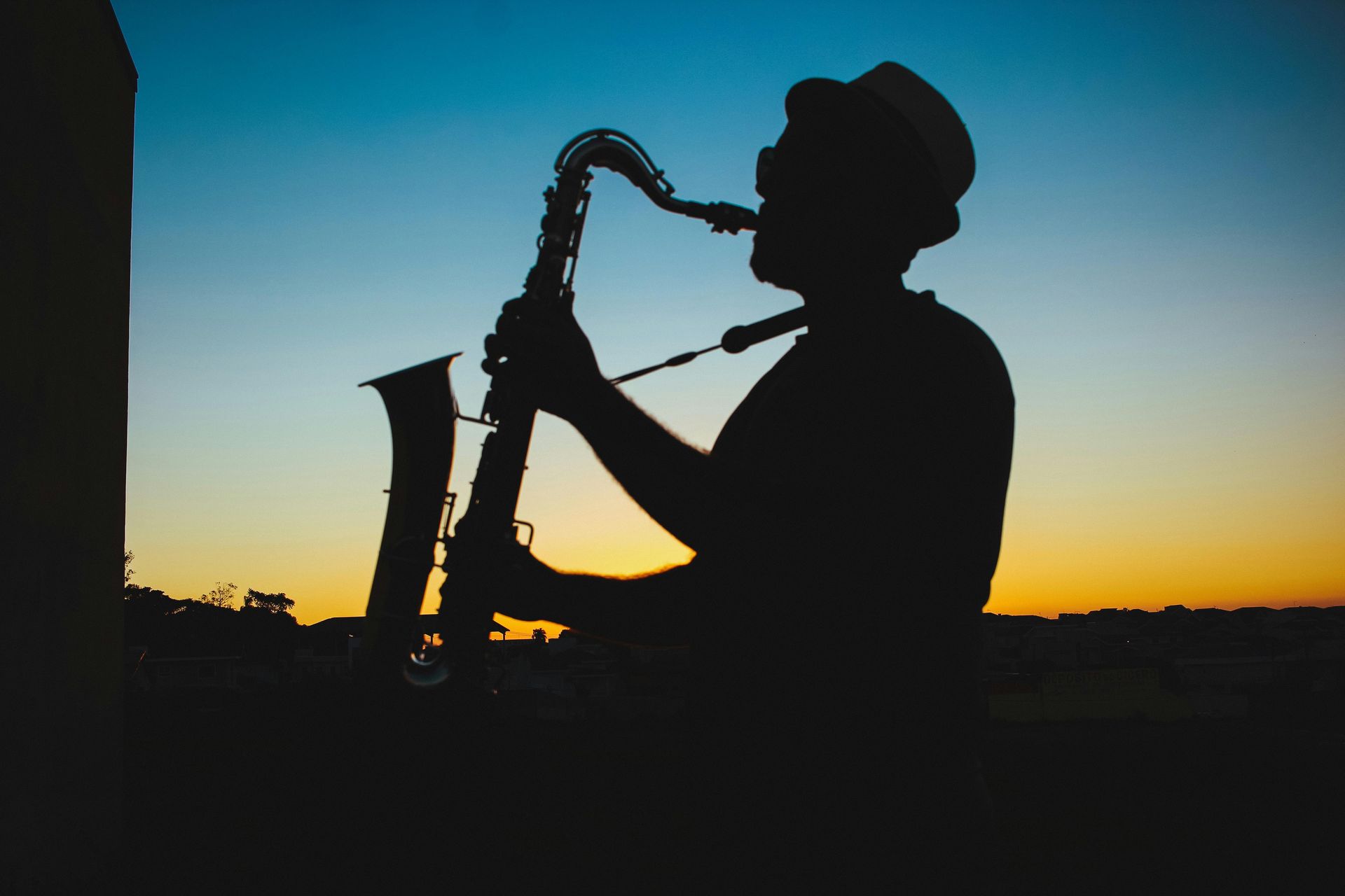 Man playing saxophone in the sunset