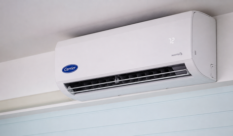 White wall-mounted air conditioner near the ceiling in a room