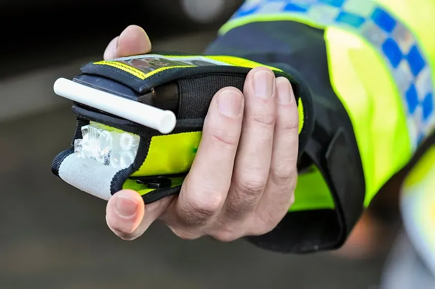 A Police Person Holding a Breath Analysis Reader — David Tamanika Solicitors in Bacchus Marsh, VIC
