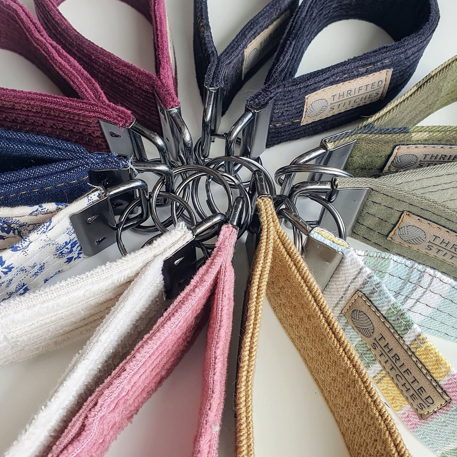 Assorted fabric tote bags with patterned straps arranged in a circular display — Tilligerry Collective in Tanilba Bay, NSW