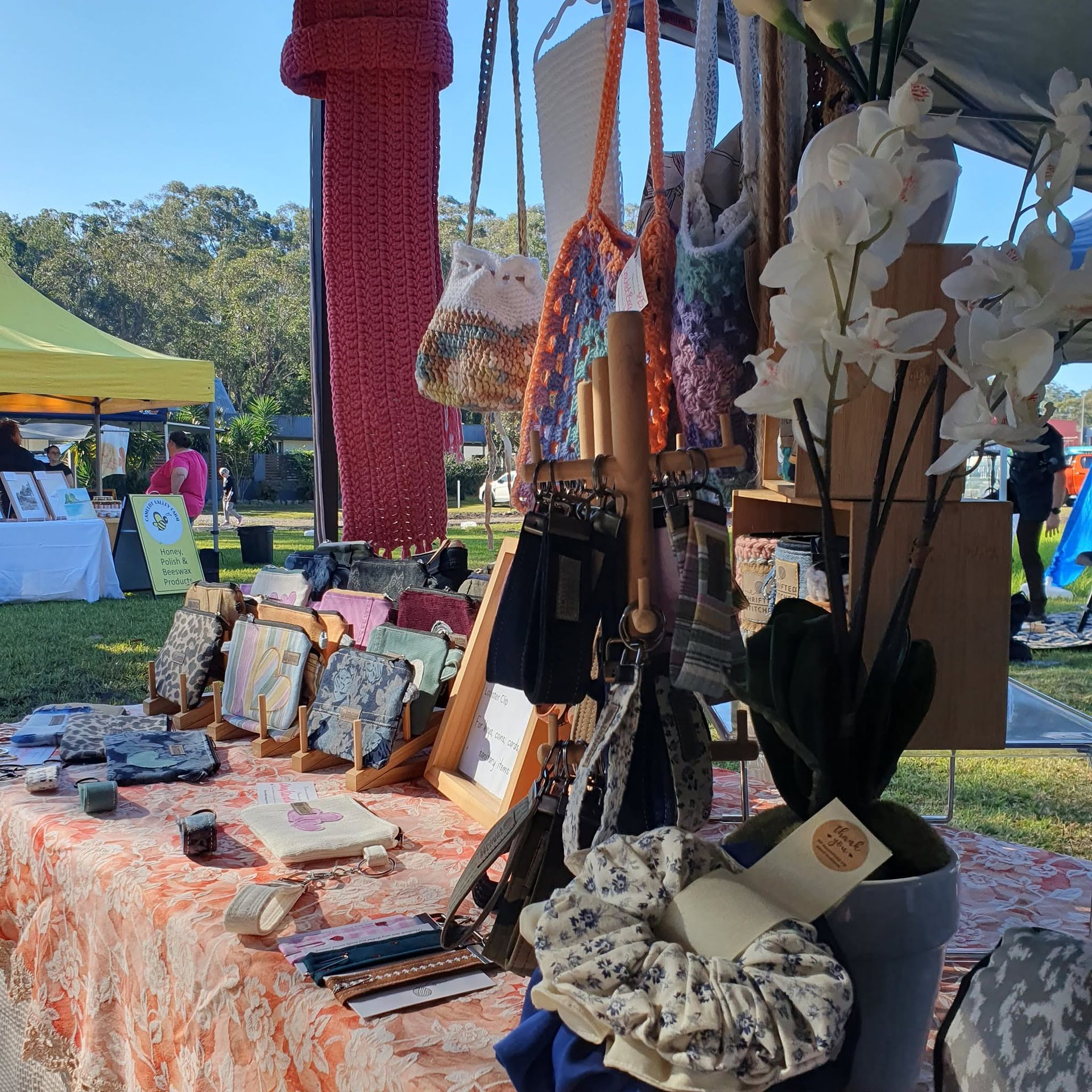 Outdoor craft fair table with handmade jewelry, bags, and accessories displayed under a canopy — Tilligerry Collective in Tanilba Bay, NSW