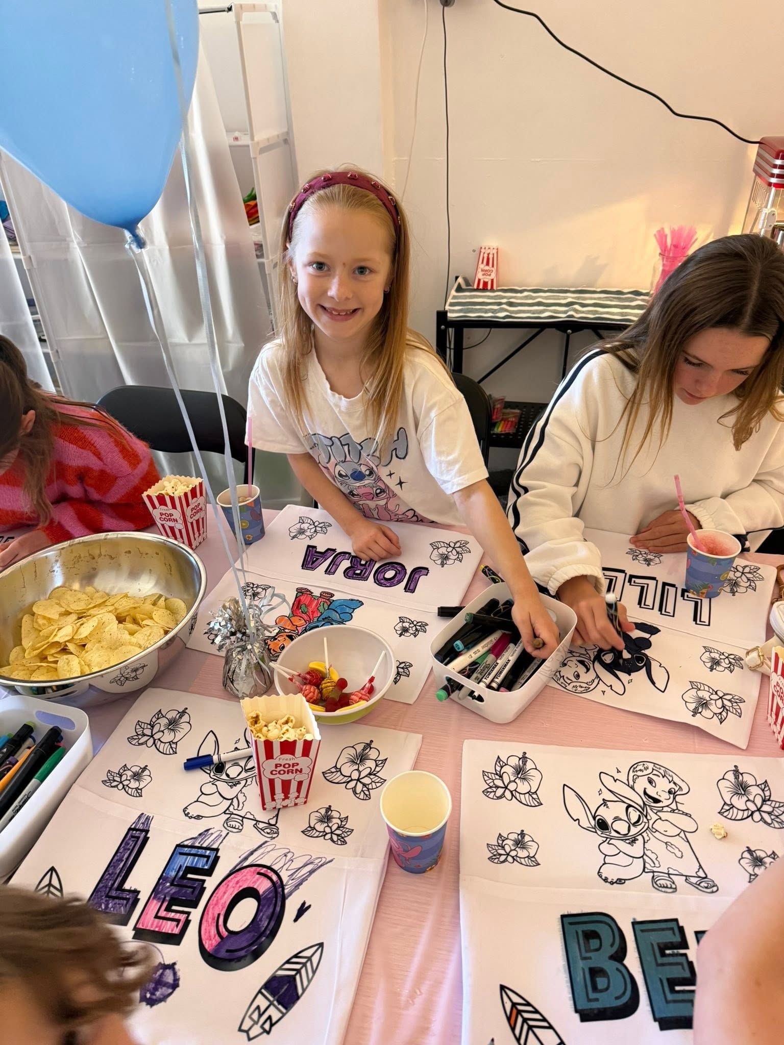 Two Children Decorating Colourful Letter Placemats at a Craft Table — Tilligerry Collective in Tilligerry Peninsula, NSW