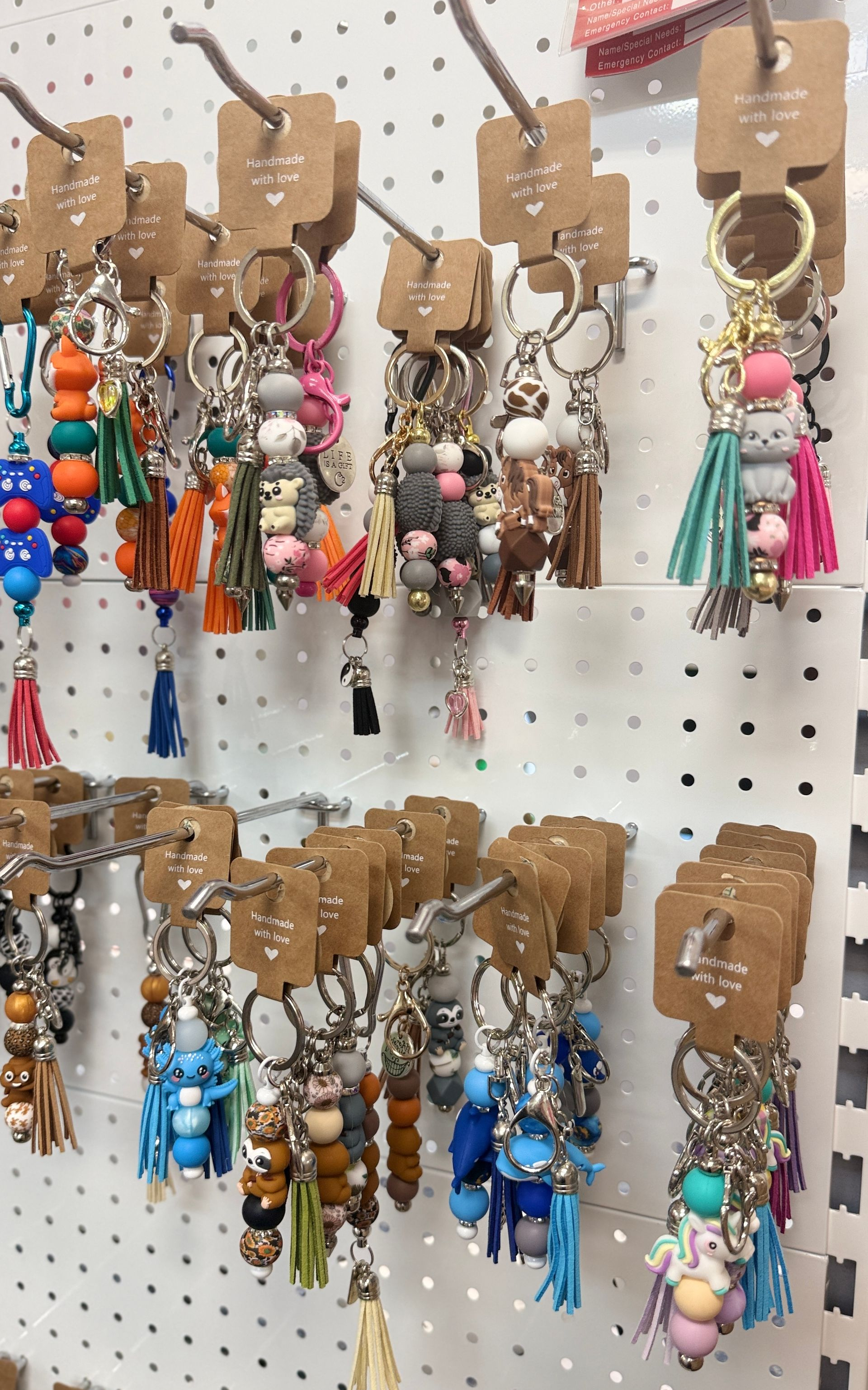 Colourful Crocheted Bags and Pouches Hanging on a Wall Display — Tilligerry Collective in Tilligerry Peninsula, NSW