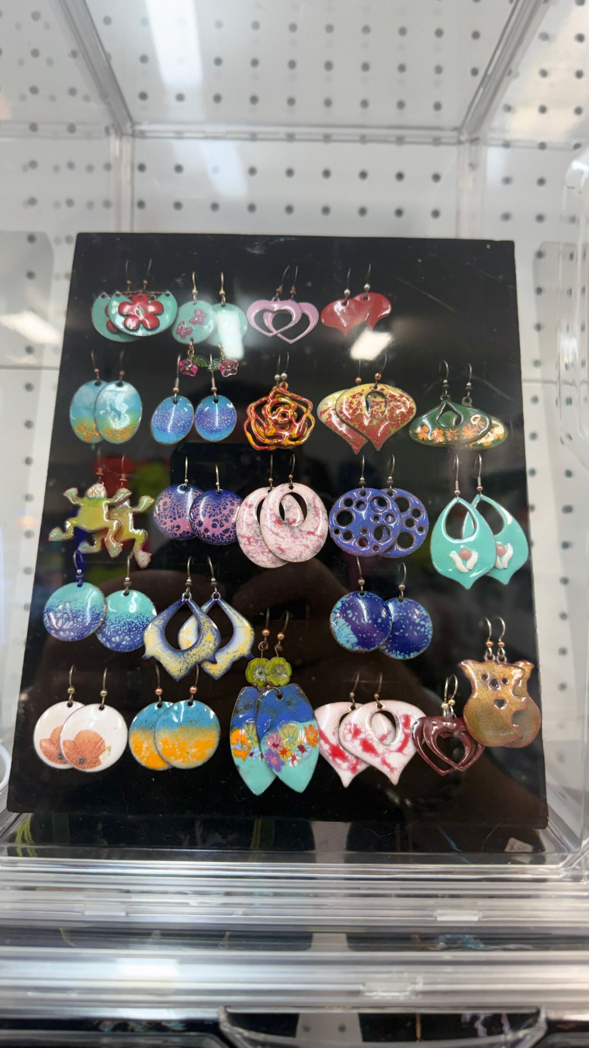 Display of colourful dangling earrings on a black jewelry board in a store. — Tilligerry Collective in Tilligerry Peninsula, NSW