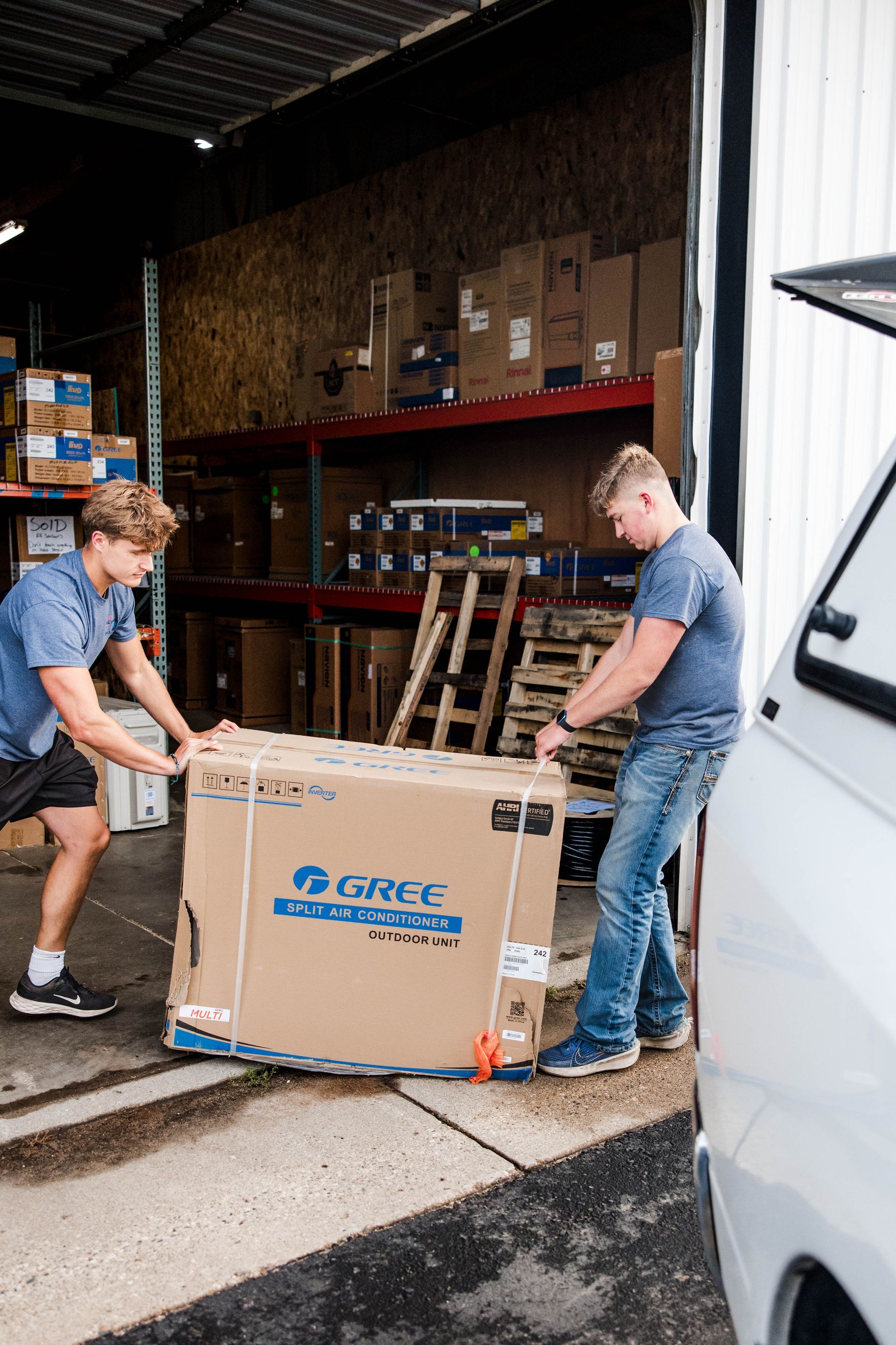 Men Carrying HVAC Equipment