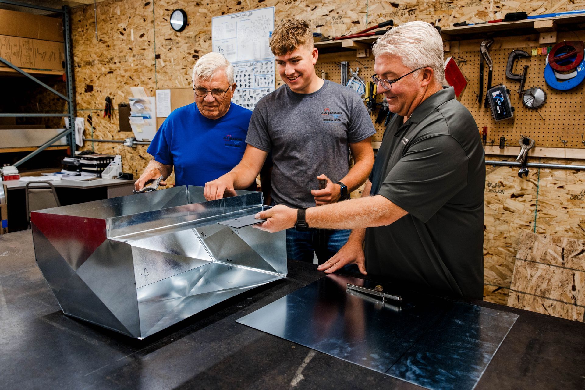 People Looking At Ductwork