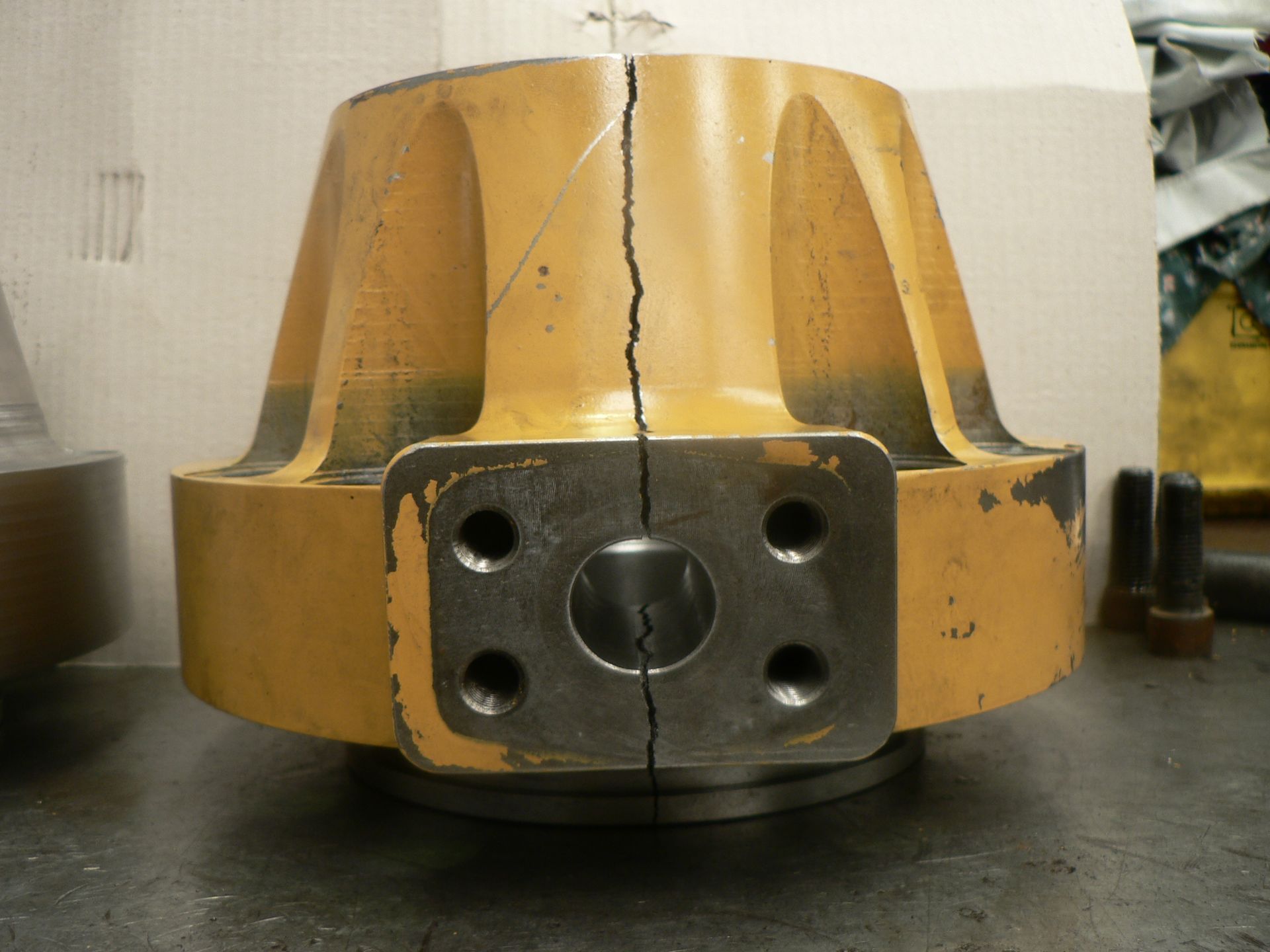 A piece of metal with holes in it is sitting on a table