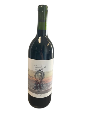 Dark wine bottle with a pale illustrated label depicting a bicycle scene