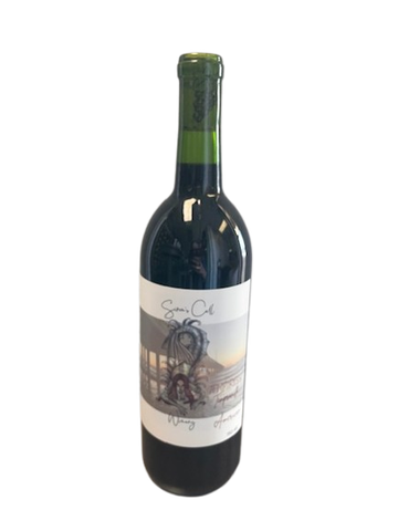 A green wine bottle with a scenic label on a white background.