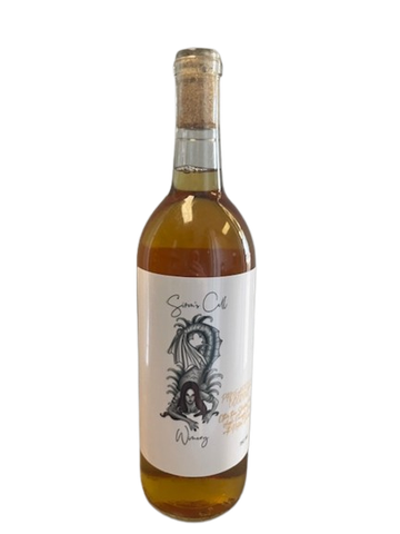Bottle of amber wine with a cork and white label on a plain background