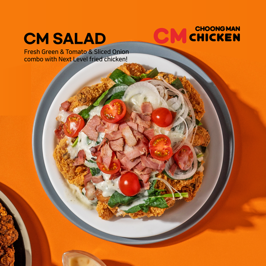 CM Salad and CM Chicken logos beside a vibrant salad plate with tomatoes, onions, greens, and sliced meat on orange background