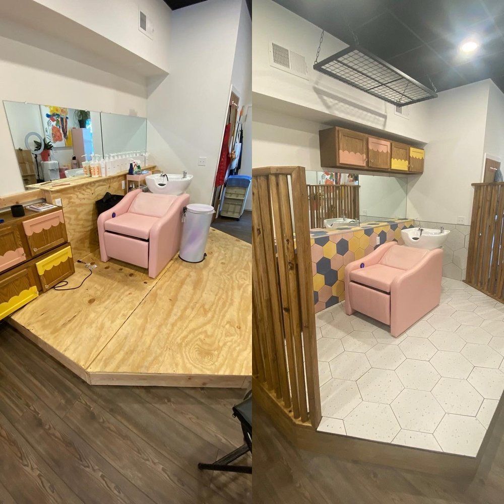 Salon with two pink pedicure chairs, mirrors, and wooden partitions in a bright interior
