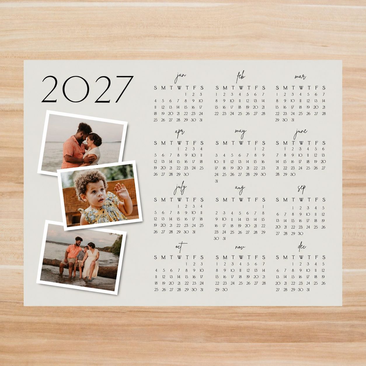 A calendar with flowers on a wooden table