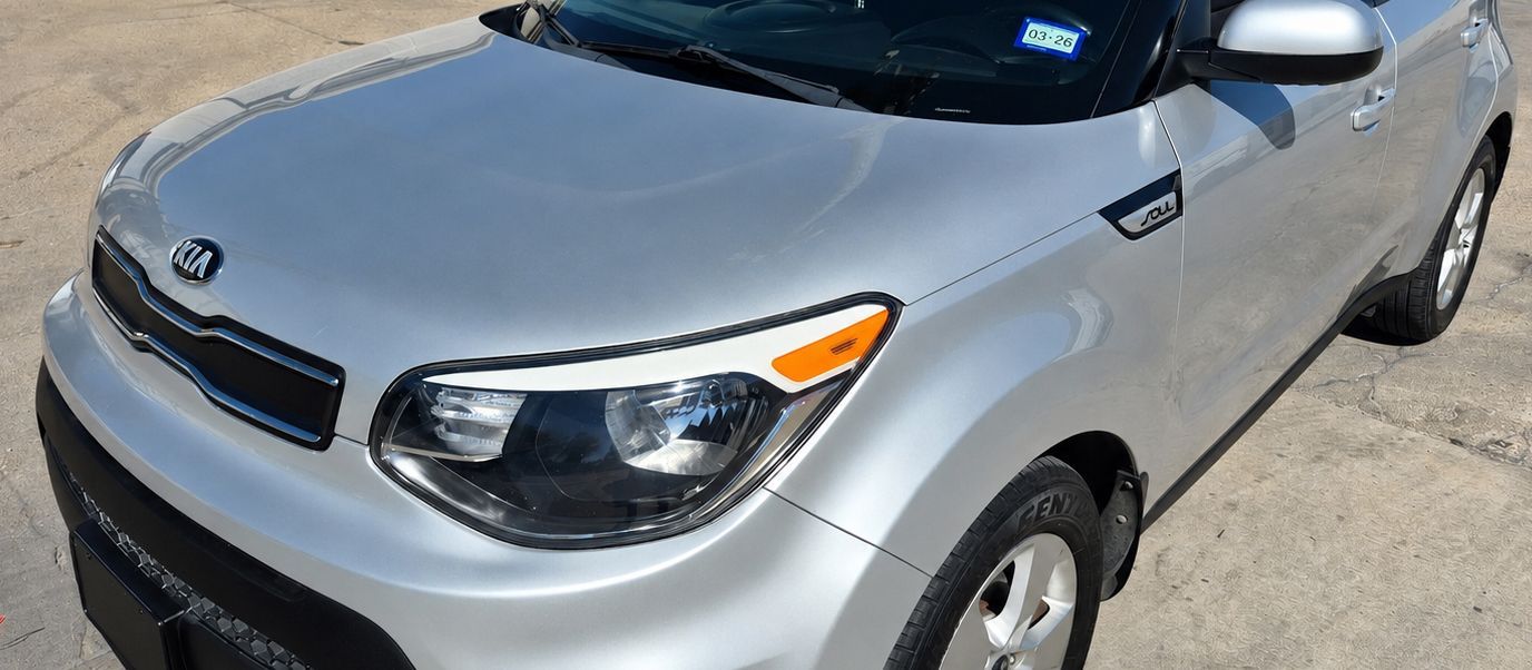 Silver compact SUV parked outdoors on a sunny day, front-left view
