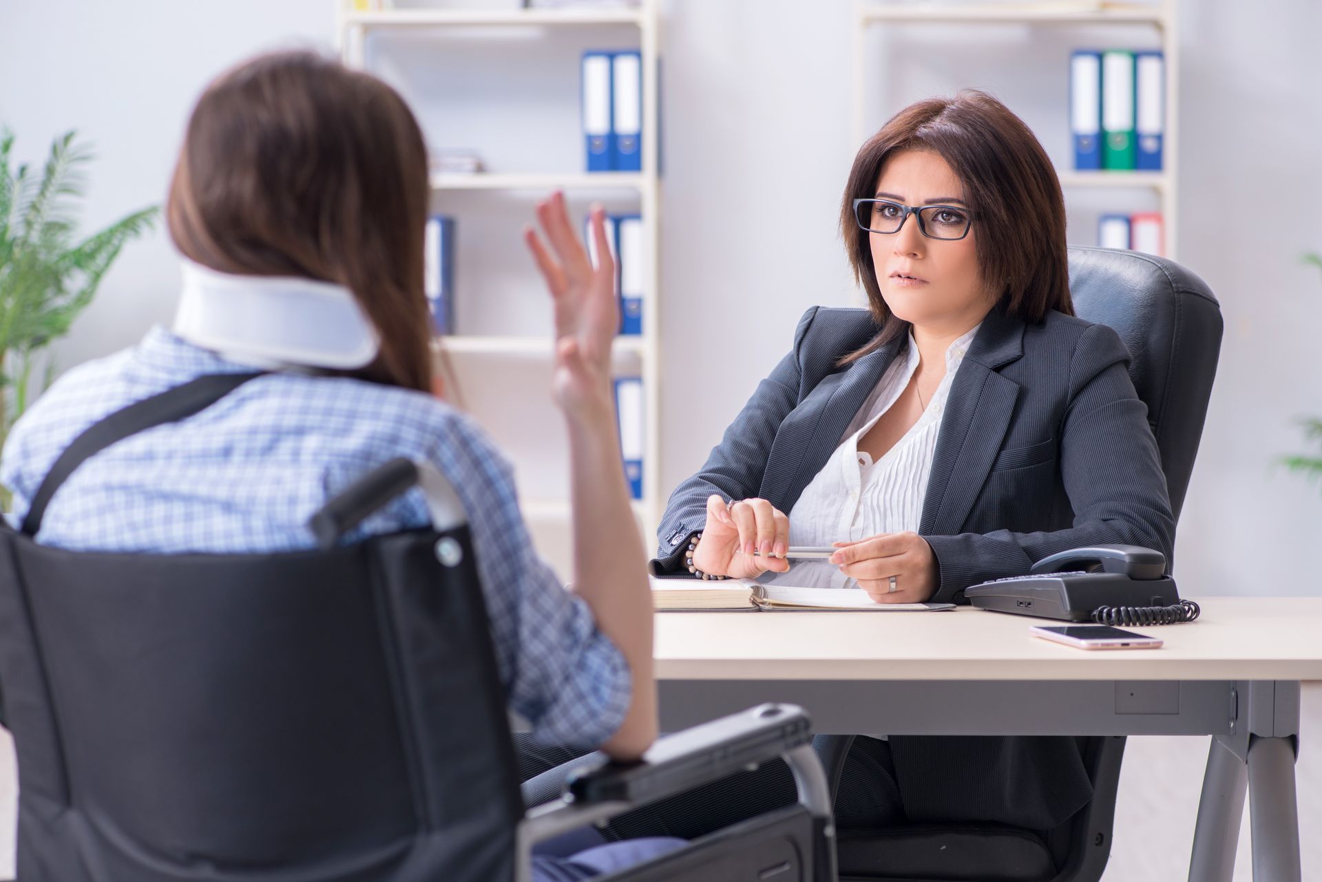 Injured employee visiting lawyer for advice on insurance. Injured employee visiting lawyer for advice on insurance.