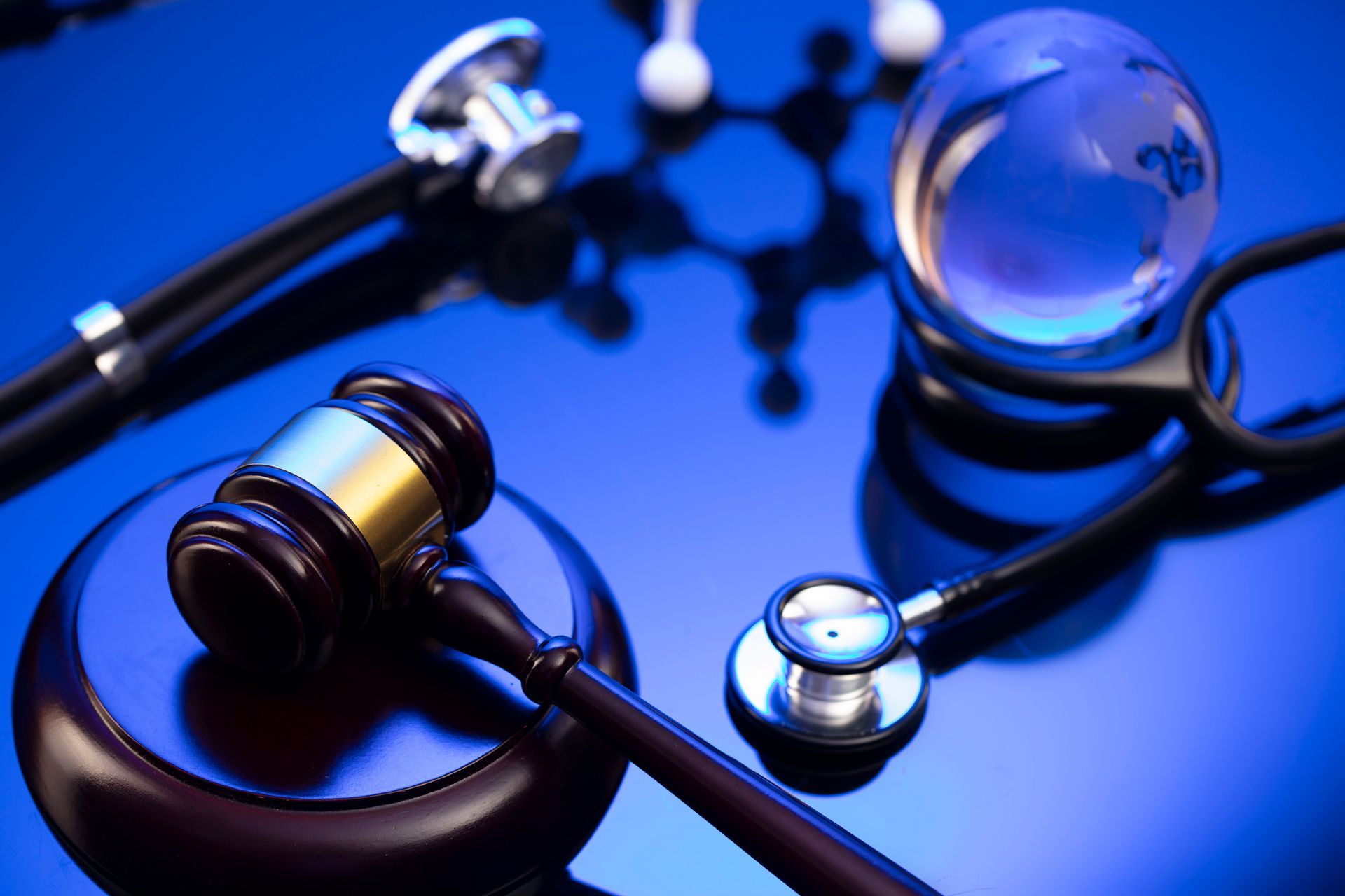 A gavel and a stethoscope on a table representing Personal Injury Attorney