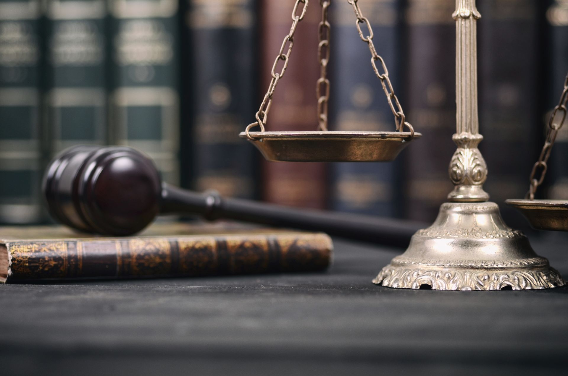 Symbolic justice scales and gavel in a law firm handling auto accident lawyers and injury claims.