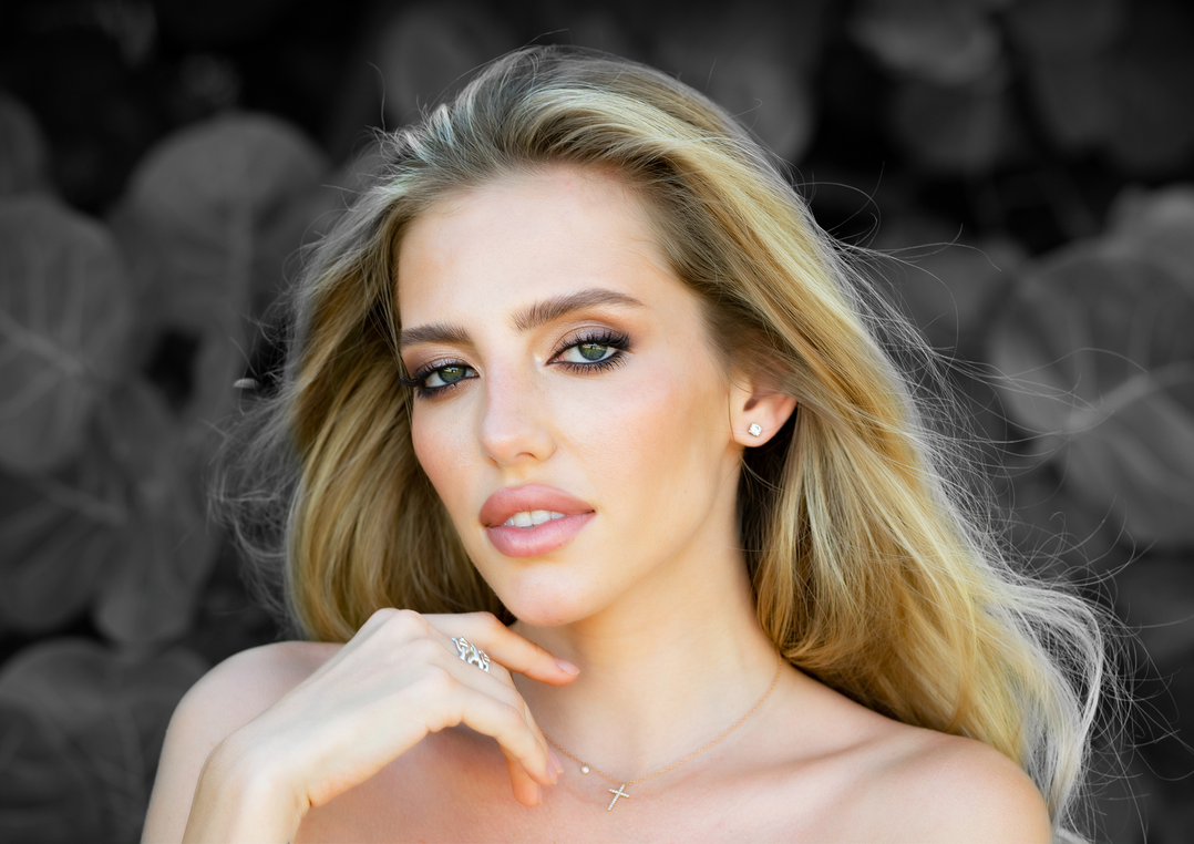 Photo of a blonde woman with a beautiful smile. 