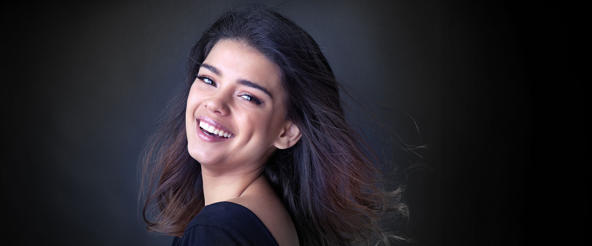 woman smiling after a smile makeover