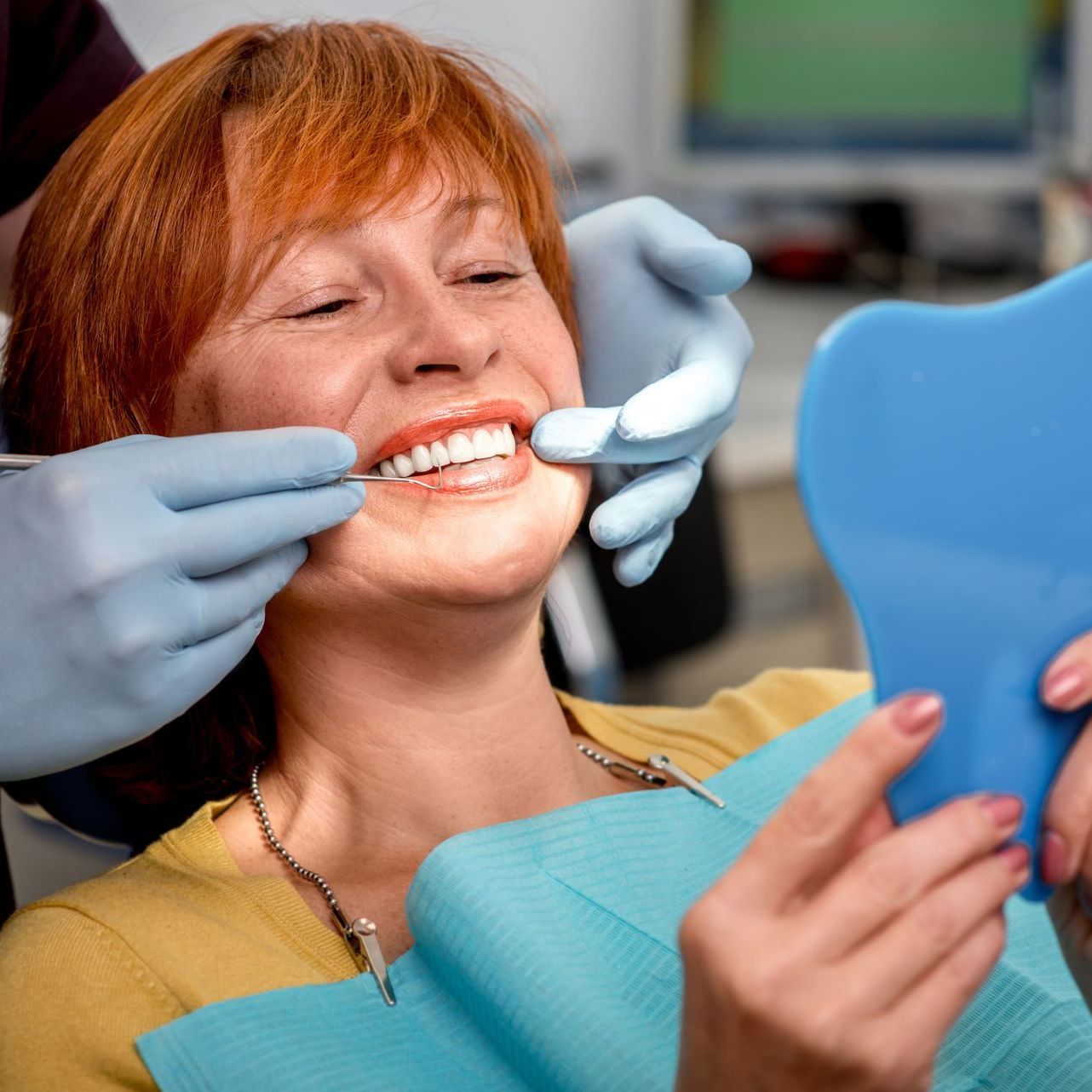 Image of patient being treated in a dental chair.