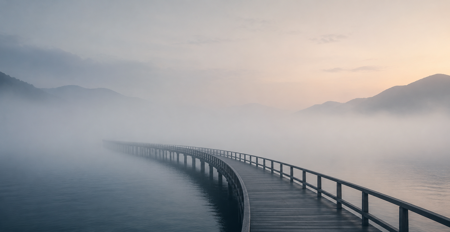 A bridge disappearing into fog, representing continuity of care and the unseen gap in appointments
