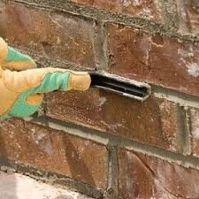 a close up of finishing touches to a chimney mortar repair job