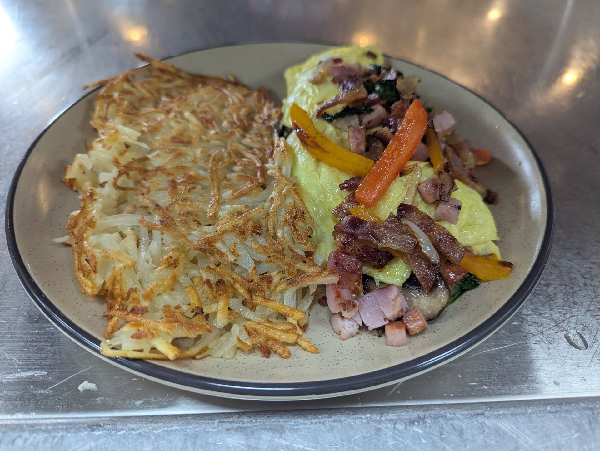 Homemade omelet with hash browns at The Phattest
