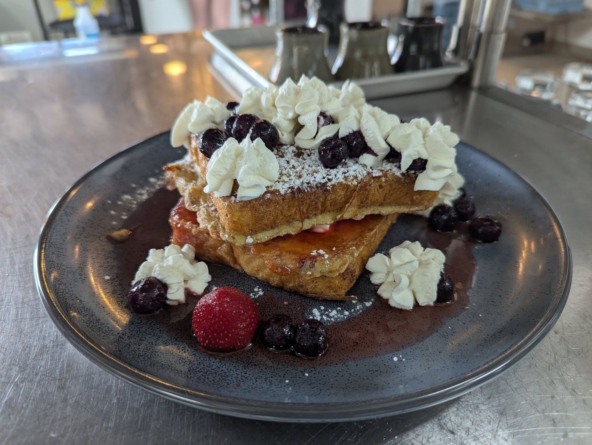 Berry French toast with whipped cream at The Phattest