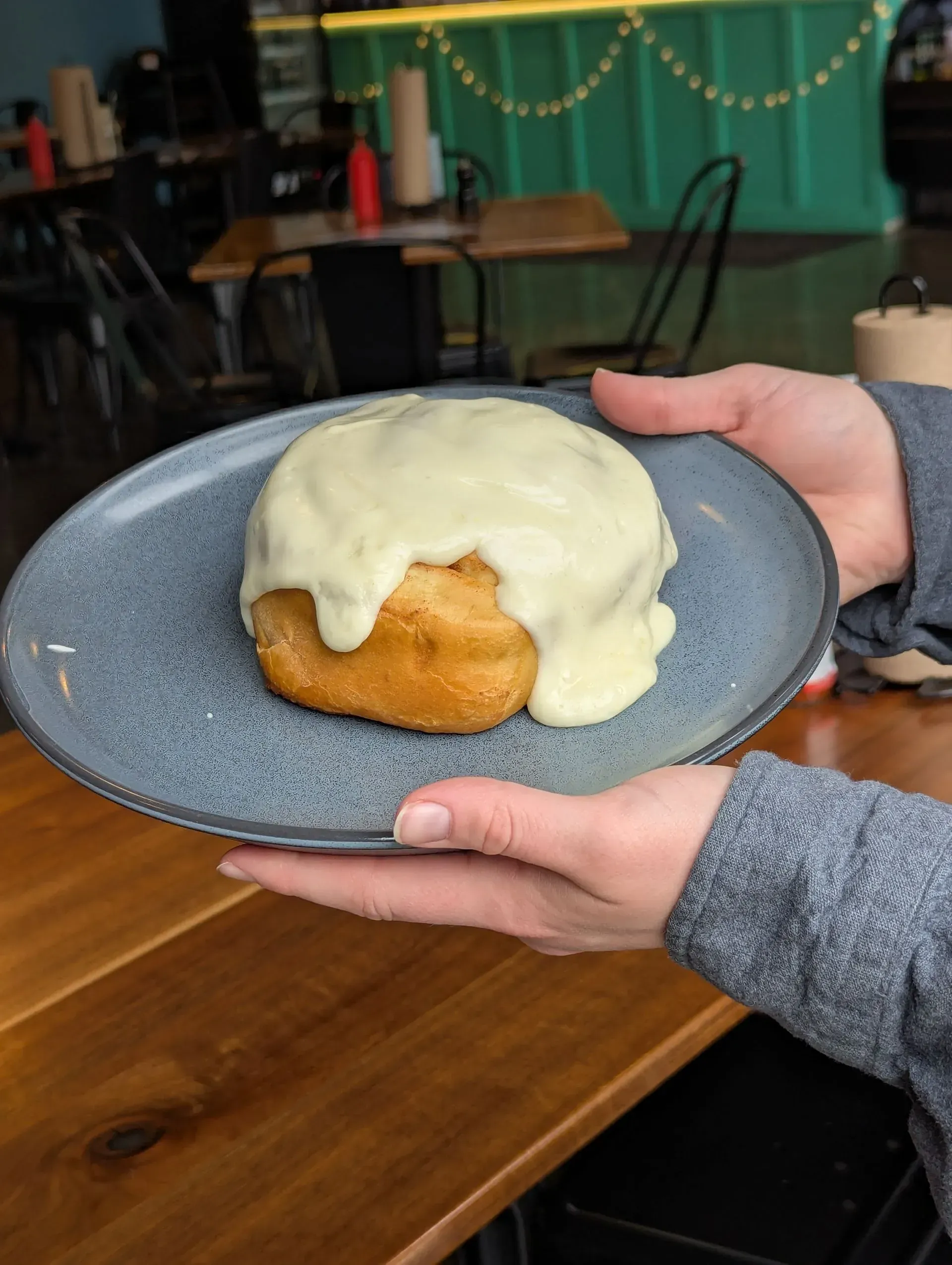 Homemade cinnamon roll with cream cheese frosting