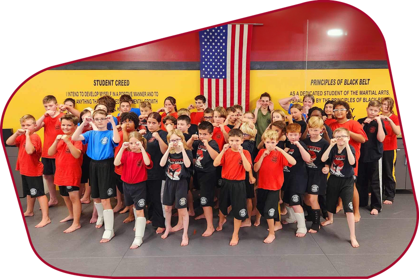 a group of kids are posing in front of a sign that says student creed