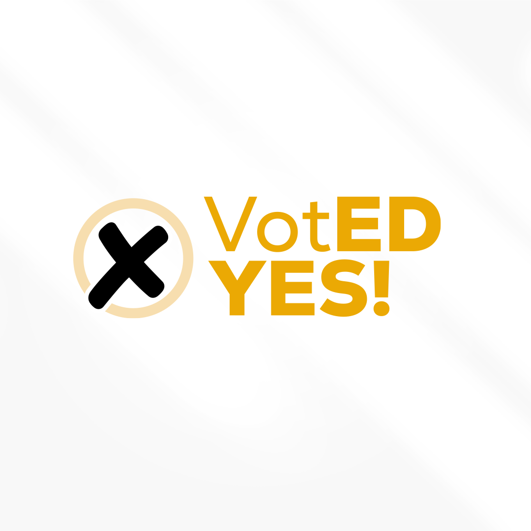 A logo that says voted yes with a cross in the middle