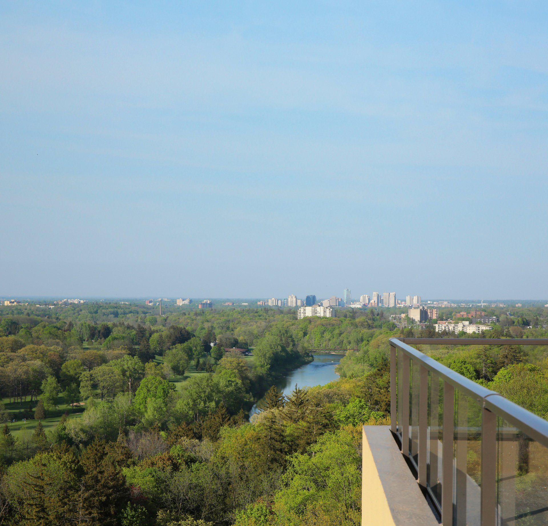 A view of a river from a balcony overlooking a city
