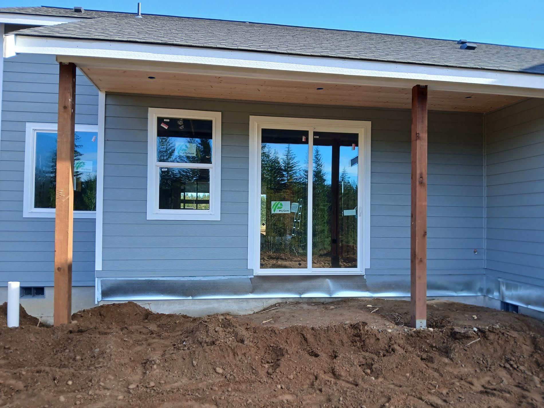 A house with a covered porch and a lot of windows