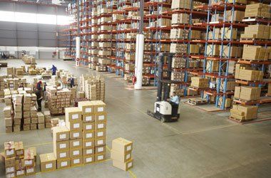 Elevated view of large distribution warehouse storing boxes