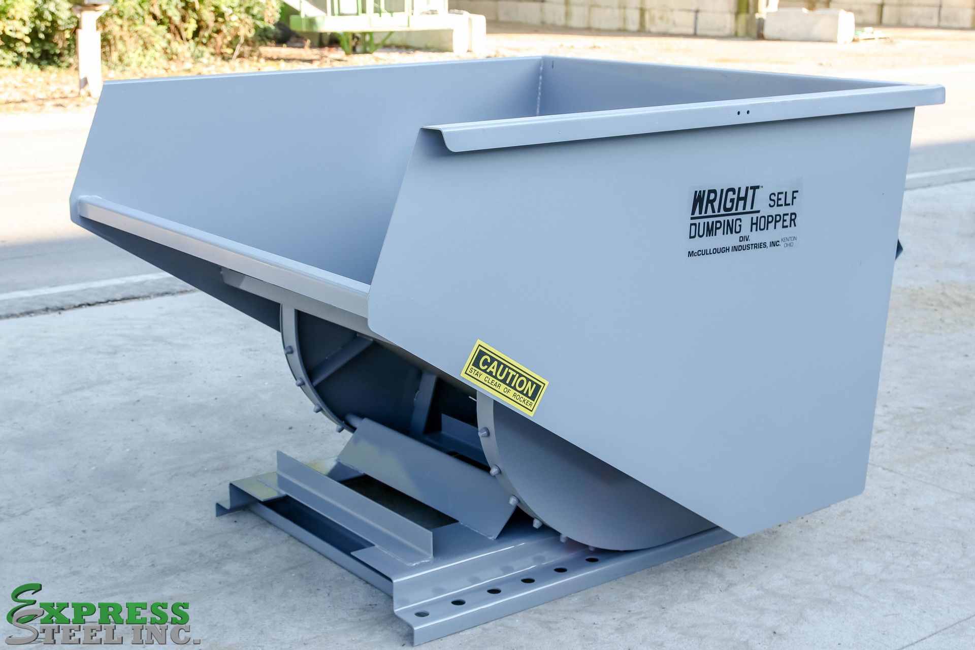 A gray dumpster with the word express on the bottom