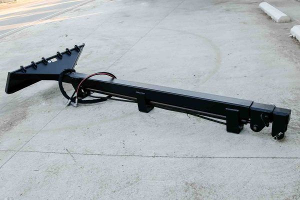 A black object is sitting on a concrete surface.